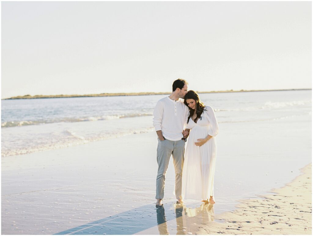 Maternity session at Wrightsville Beach with soft fall light and coastal scenery