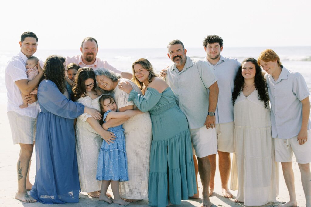 Topsail Beach photographer capturing a family at sunrise along the shoreline
